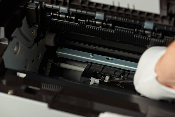 Checking modern printer mechanism - Foto, afbeelding