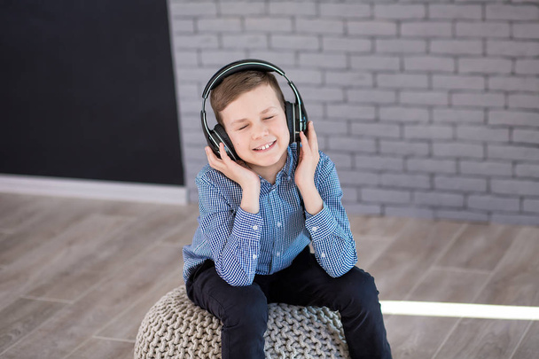 Relax and listening music concept. European boy fill the bit. Boy in casual wear. - Foto, imagen
