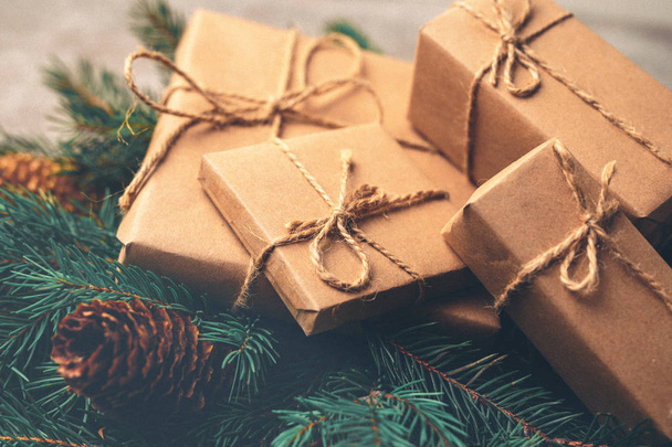 Christmas background. Gift boxes and decoration -  tree and cone - Valokuva, kuva
