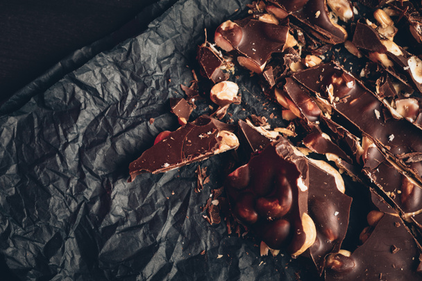 dark chocolate on gray wrapper - Photo, Image
