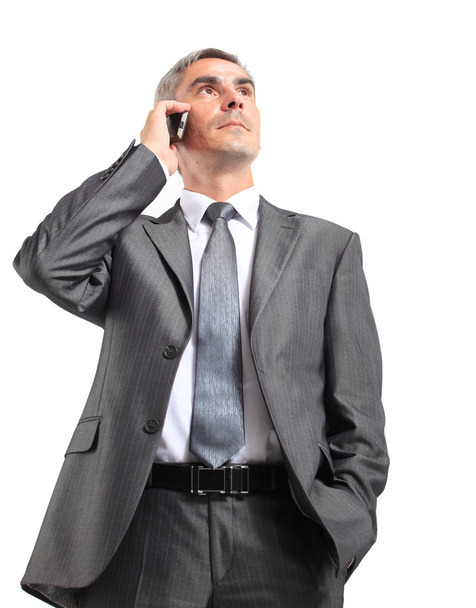 Portrait of Caucasian business man using cellphone on white background - Фото, зображення