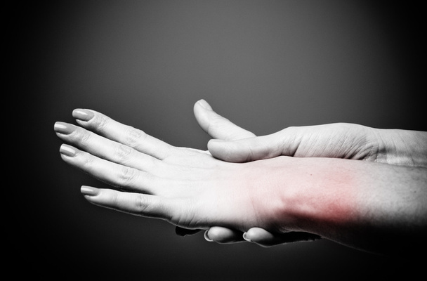 Acute pain in a women wrist - Photo, Image