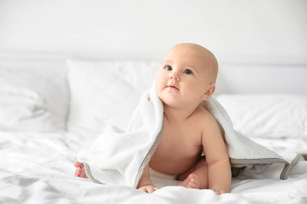 baby boy on bed - Фото, изображение
