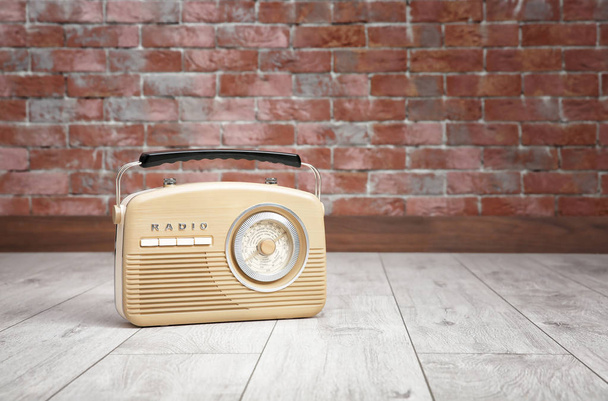 Retro radio on floor - Фото, зображення