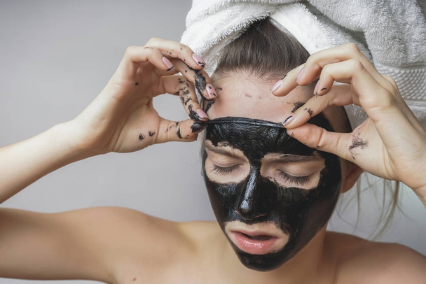 Woman remove black mack.Face scrab,exfoliation pores,clean skin - Fotó, kép