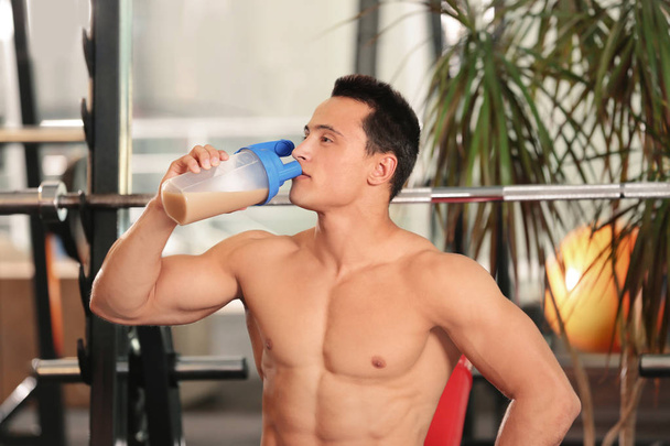 Handsome young man with protein shake  - Fotó, kép