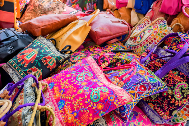 Range of colorful ethnic bags on Indian market - Photo, Image