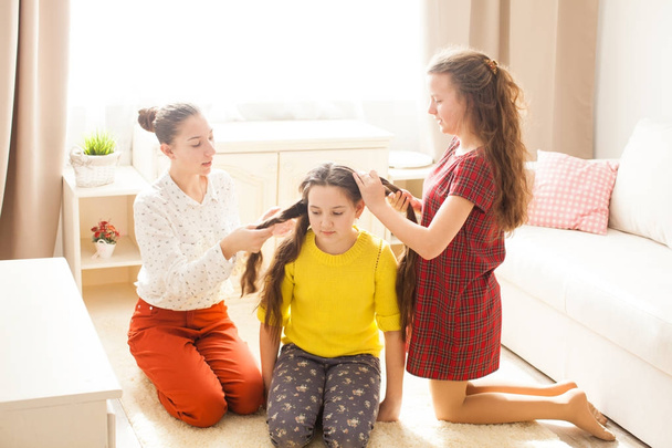 Girlfriends doing hairstyle - Photo, image