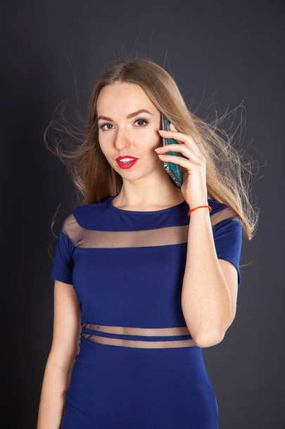 Photo shoot beautiful blonde woman in navy blue dress - Fotografie, Obrázek