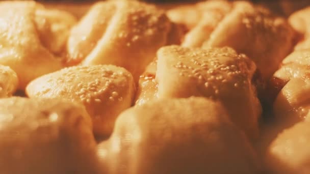 sweet pastry with sesame and jam in the oven, time, cooking process - Felvétel, videó