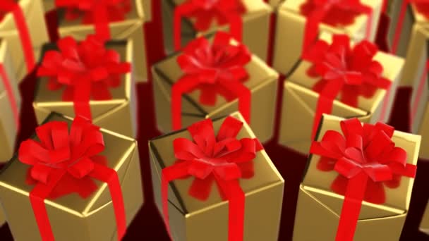Neujahr und Weihnachten goldene Geschenkboxen mit roter Schleife - Filmmaterial, Video
