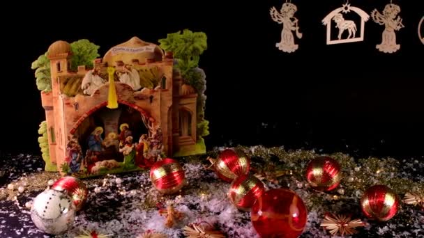 Nativity scene and Christmas collection on black background. Christmas decoration. Christmas balls. - Footage, Video