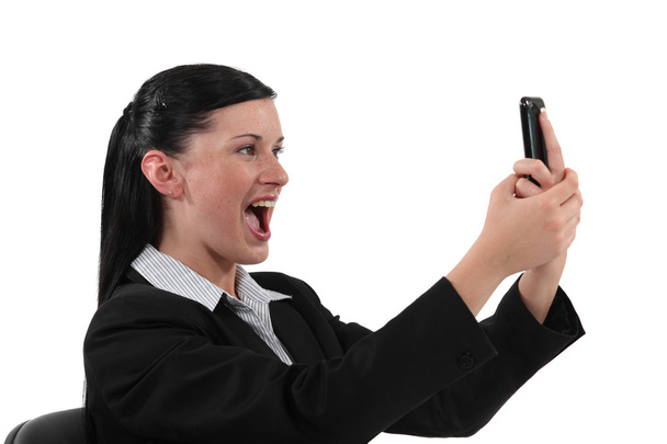 Overjoyed woman reading text message - Zdjęcie, obraz