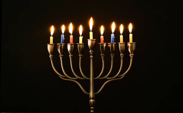 jewish holiday Hanukkah background with menorah (traditional candelabra) and burning candles - Foto, Imagen