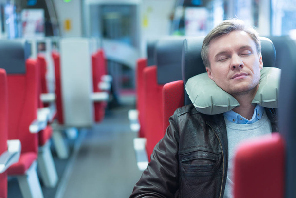 Sleeping man in train - Photo, Image
