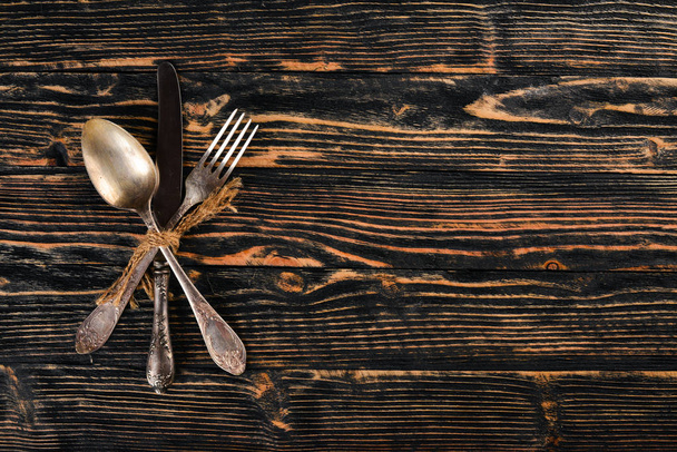 Cutlery. Vintage On a wooden background. Top view. Free space for text. - Fotografie, Obrázek