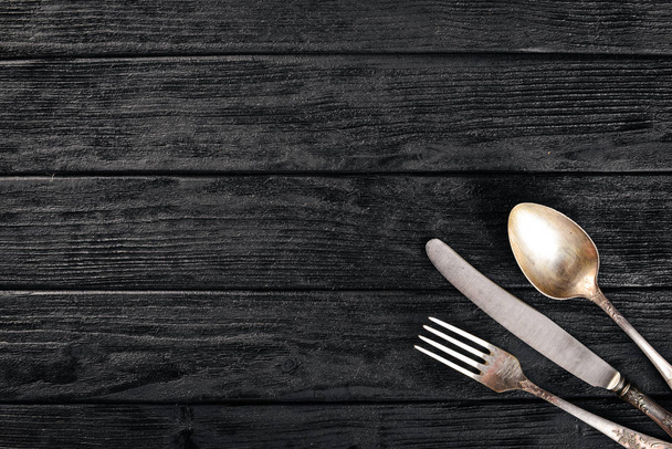 Cutlery. Vintage On a wooden background. Top view. Free space for text. - Foto, afbeelding