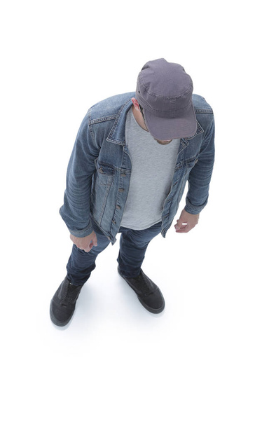 view from above. guy in a baseball cap and denim jacket - Photo, image