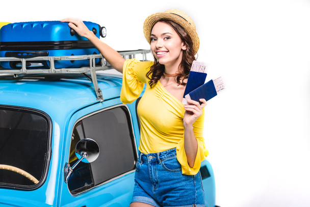 woman with tickets next to vintage car - Photo, Image
