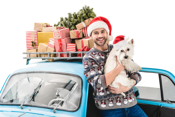man with dog and christmas gifts on car - Photo, Image