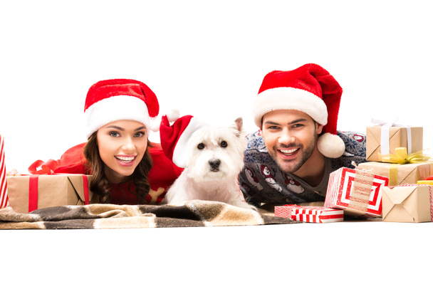 young couple with dog and christmas gifts - Photo, Image