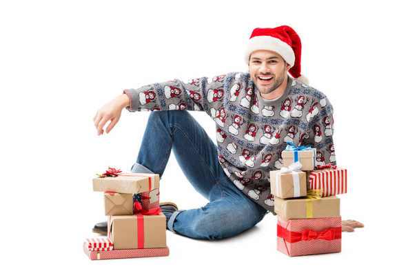 man sitting on floor with christmas gifts - Fotoğraf, Görsel