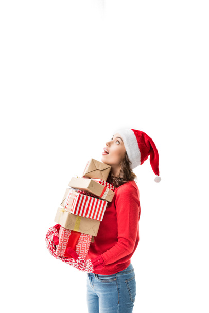 Жінка тримає стек різдвяні подарунки - Фото, зображення