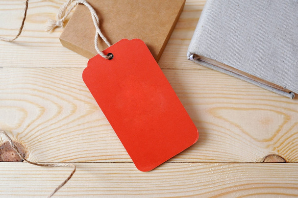 Large Price red Tag red tag on a golden wooden background - Photo, Image