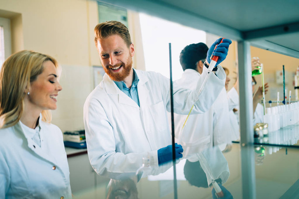 students of chemistry working in laboratory - Фото, зображення