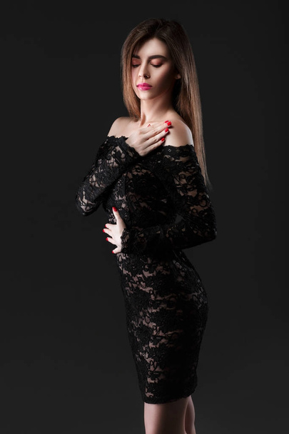 beautiful woman in a black dress - Fotoğraf, Görsel