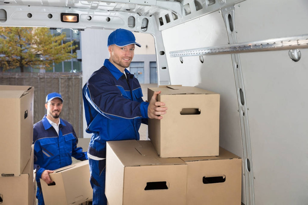 Movers Carrying Cardboard Boxes - Photo, Image