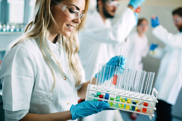  students of chemistry working in laboratory - Foto, immagini