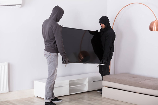 Robbers Stealing Television  - Foto, immagini