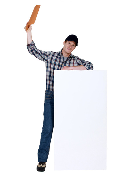 Man holding roof tile - Valokuva, kuva