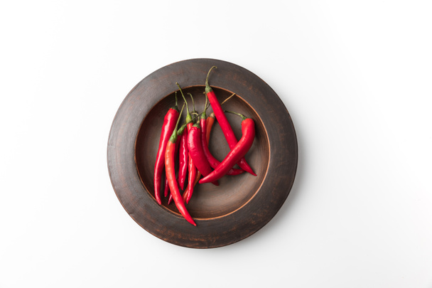 red chili peppers on black plate  - Photo, Image