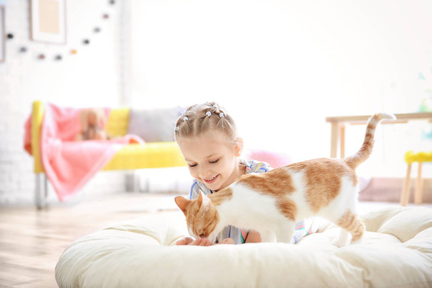 little girl with cat  - Фото, изображение