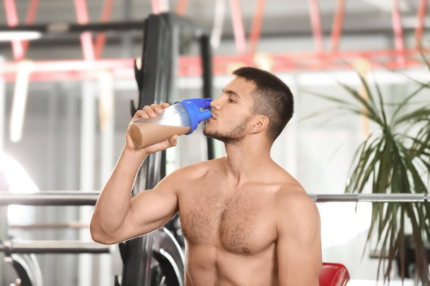 Handsome young man with protein shake - Photo, Image