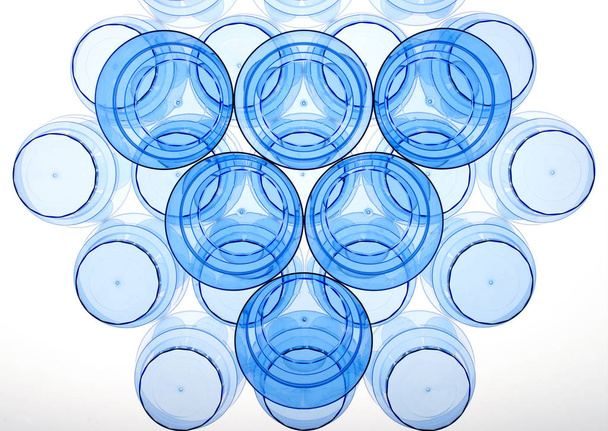 Abstract plastic cups flat lay with blue palette - Photo, Image