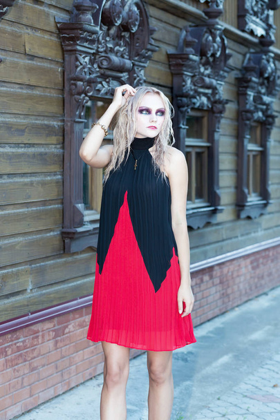 A fashion gothic style portrait of a beautiful blonde girl - Foto, Imagen