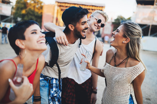 Group of young friends having fun time at music festival - Foto, imagen