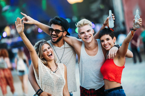 Group of young friends having fun time at music festival - Φωτογραφία, εικόνα