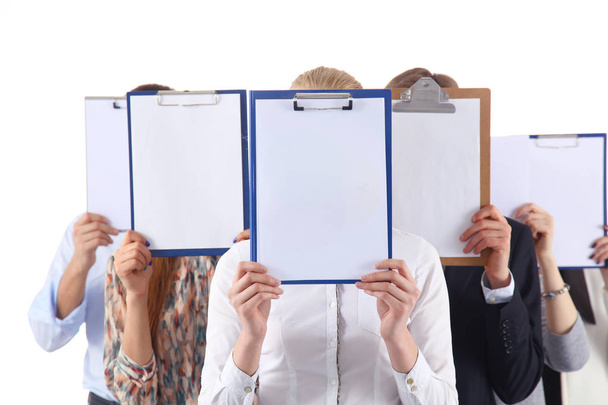Team of businesspeople holding a folders near face isolated on white background . Businesspeople. - Fotografie, Obrázek