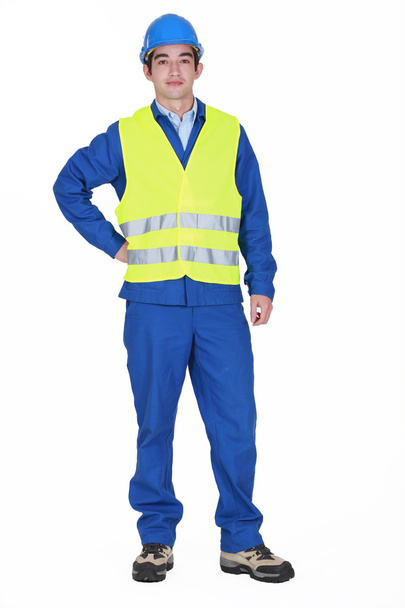 Construction worker standing on white background - Фото, изображение