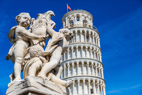 Leaning tower in Pisa with statue of angels   in a summer day in Italy - Photo, image