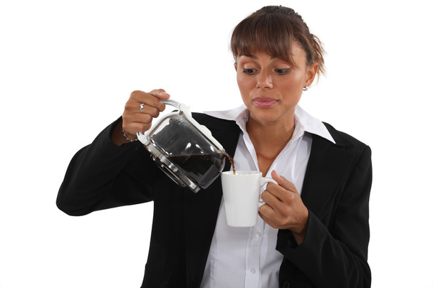Woman pour coffee into mug - Fotografie, Obrázek