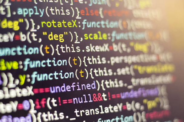 Minificated web development javascript code close up. Abstract information digital technology modern background. HTML5 concept macro backdrop in cold colors. Screen of web developer. - Photo, Image