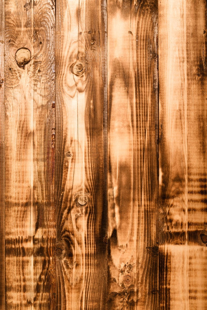 Burned weathered wooden board. Rustic texture for background. To - Zdjęcie, obraz