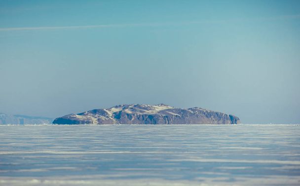 Baikal Lake. Ice, rocks, winter Landscape in Siberia - Фото, изображение
