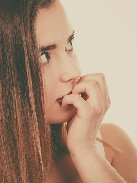 Teenage woman looking worried, thinking about something - Foto, Imagem