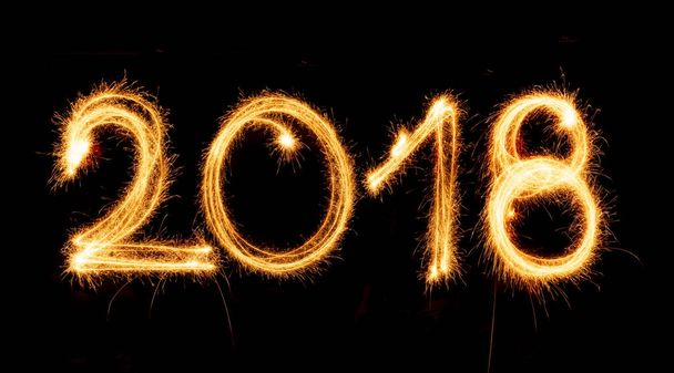 2018 with sparklers on black background - Zdjęcie, obraz